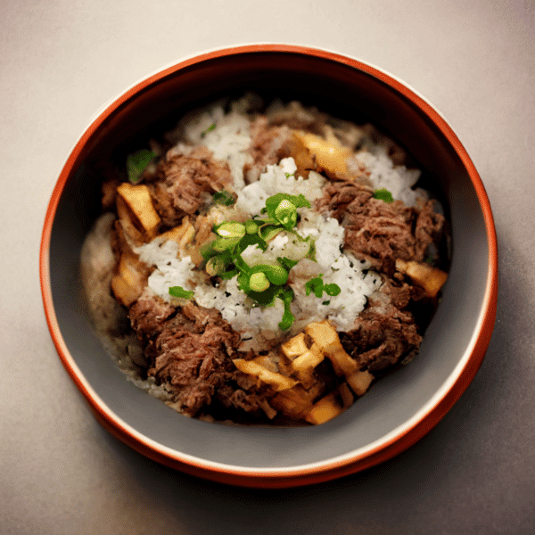 A bowl of savoury beef and tofu over rice garnished with green onions, a popular choice from Crave Healthy's diverse menu for wholesome meal delivery options in Vancouver.